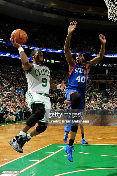 Rajon Rondo of the Boston Celtics shoots against Jarvis Varnado of the Philadelphia 76ers on April 4, 2014 at the TD Garden in Boston, Massachusetts....