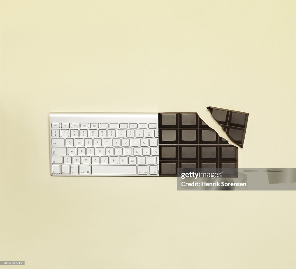 Combination of a bar of chocolate and a keyboard