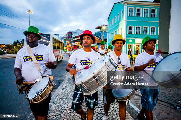 a group of people celebrating carnival outside. - brazilian carnival foto e immagini stock