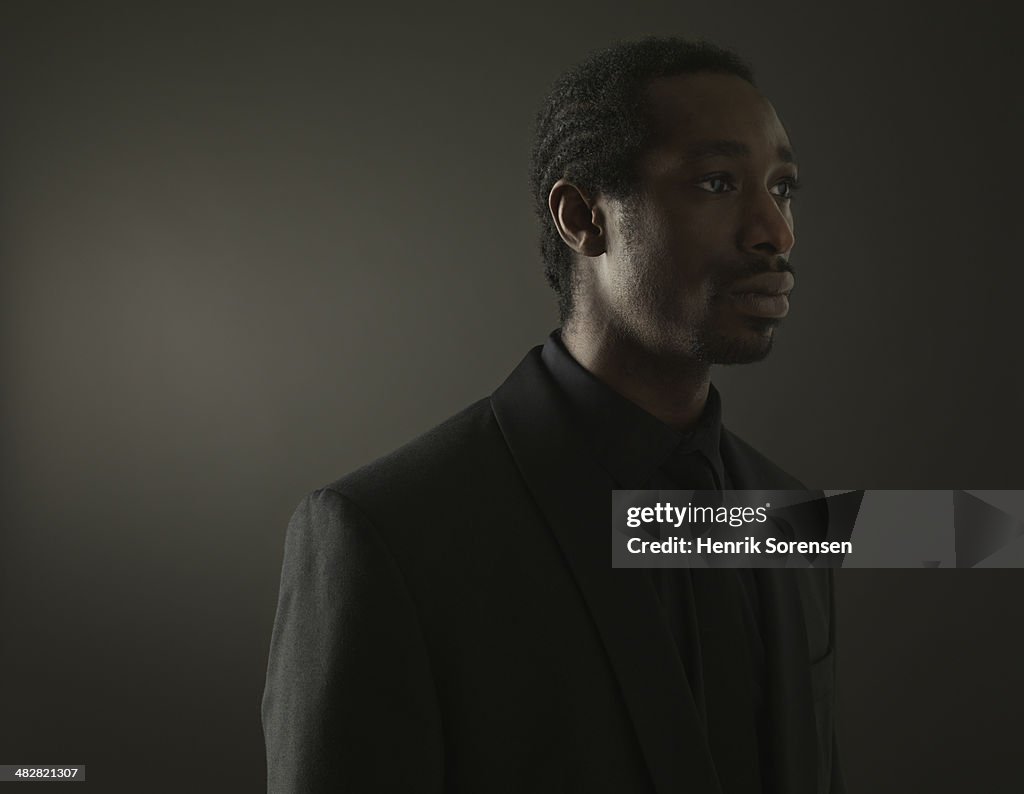 Portrait of a black man on a dark background