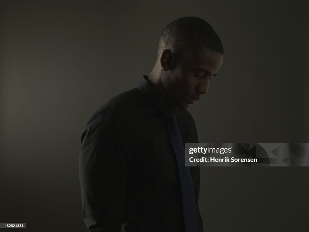 Portrait of a black man on a dark background