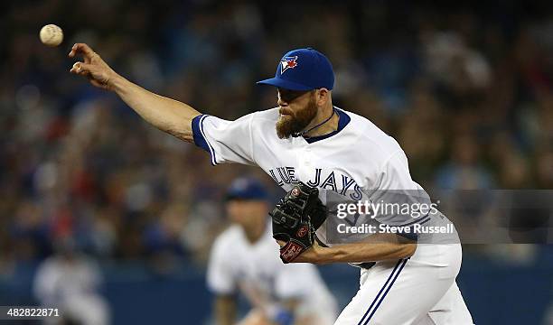 Toronto Blue Jays relief pitcher Steve Delabar throws as the Toronto Blue Jays lose to the New York Yankees 7-3 in their home opener at Rogers Centre...