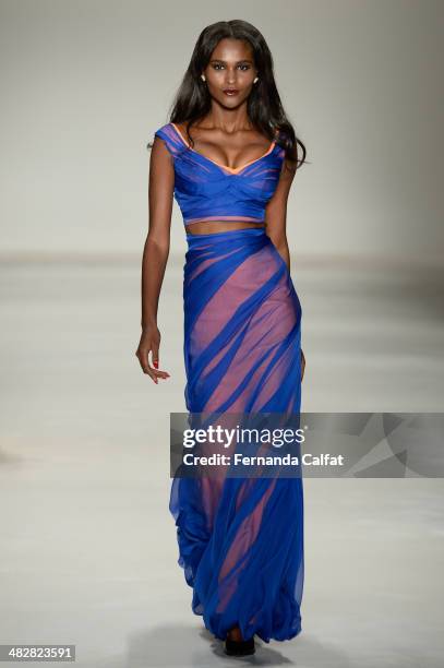 Model walks the runway during Samuel Cirnansck show at Sao Paulo Fashion Week Summer 2014/2015 at Parque Candido Portinari on April 4, 2014 in Sao...