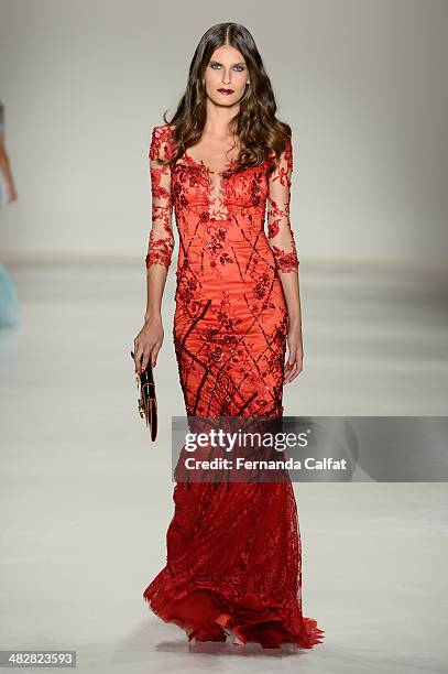 Model walks the runway during Samuel Cirnansck show at Sao Paulo Fashion Week Summer 2014/2015 at Parque Candido Portinari on April 4, 2014 in Sao...