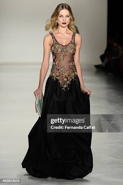 Model walks the runway during Samuel Cirnansck show at Sao Paulo Fashion Week Summer 2014/2015 at Parque Candido Portinari on April 4, 2014 in Sao...