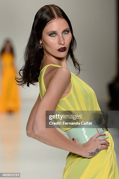 Model walks the runway during Samuel Cirnansck show at Sao Paulo Fashion Week Summer 2014/2015 at Parque Candido Portinari on April 4, 2014 in Sao...