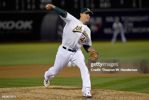 Jim Johnson of the Oakland Athletics pitches against the Cleveland Indians during the ninth inning at O.co Coliseum on April 2, 2014 in Oakland,...