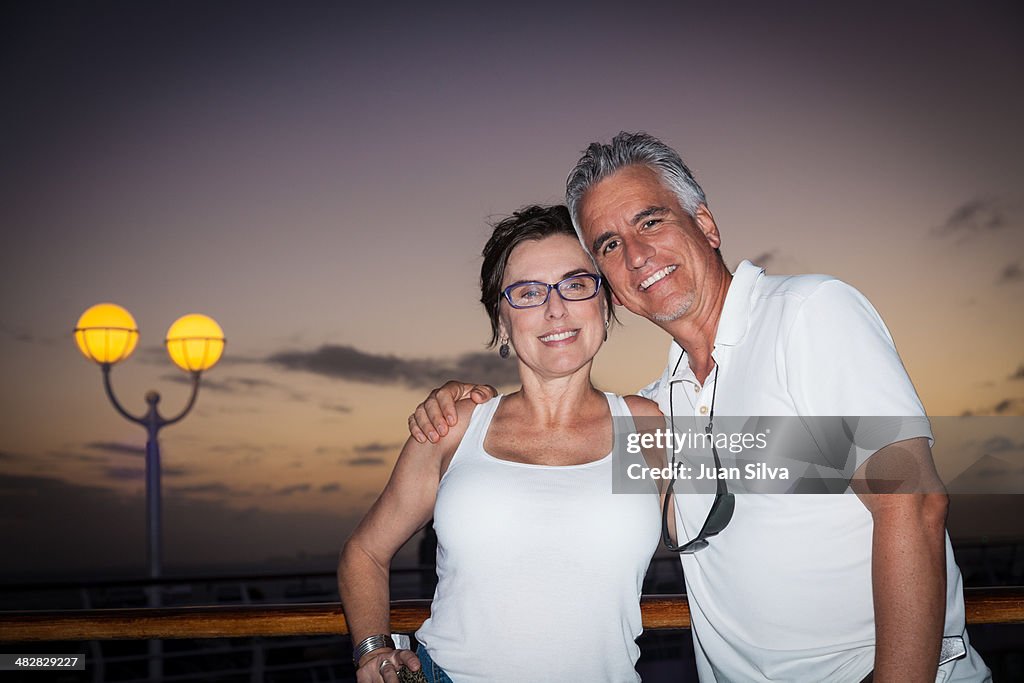 Adult couple on a cruise ship at dusk