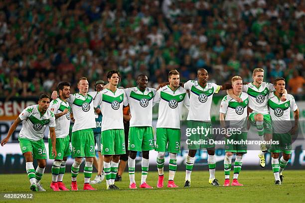 The Wolfsburg team watch the penalty shoot out during the DFL Supercup match between VfL Wolfsburg and FC Bayern Muenchen at Volkswagen Arena on...