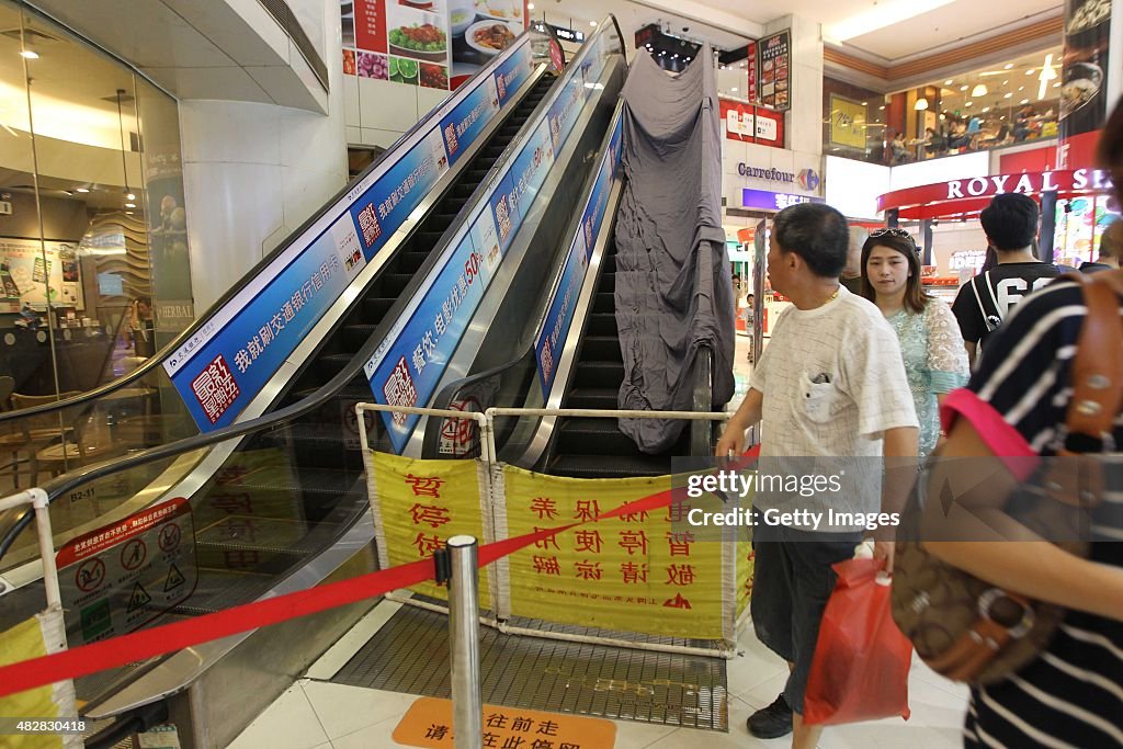 Cleaner's Leg Caught Into Escalator At Shopping Mall In Shanghai