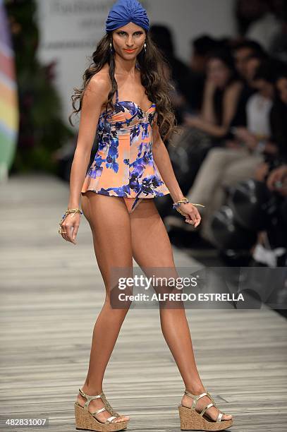 Model displays a creation by Colombian Zingara swimwear during the Autumn-Winter Mexican Fashion Week on April 04, 2014 in Mexico city. AFP...