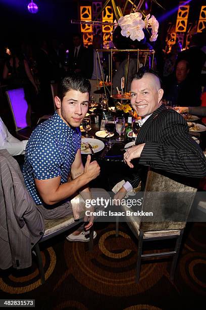 Recording artist Nick Jonas and No Doubt drummer Adrian Young attend the 13th annual Michael Jordan Celebrity Invitational gala at the ARIA Resort &...