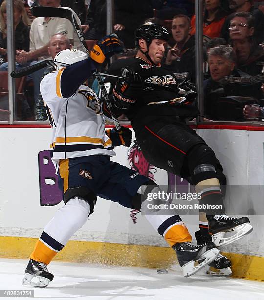 Patric Hornqvist, left, of the Nashville Predators pounds Tim Jackman of the Anaheim Ducks into the boards on April 4, 2014 at Honda Center in...