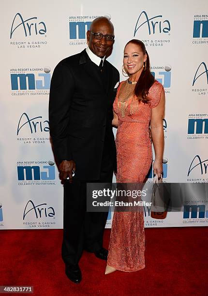 Hall of Fame National Football League player Eric Dickerson and guest arrive at the 13th annual Michael Jordan Celebrity Invitational gala at the...