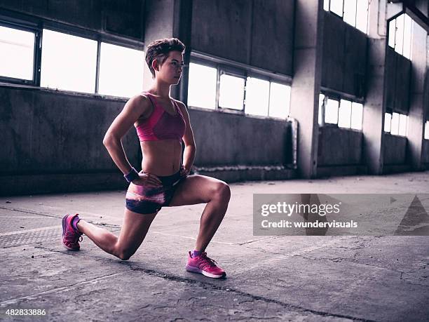 teen girl doing a lunge warm up exercise - daily sport girls bildbanksfoton och bilder