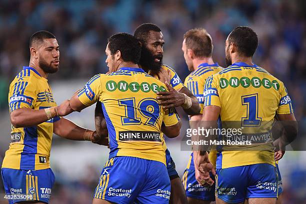 Bureta Faraimo of the Eels celebrates scoring a try with team mates during the round 21 NRL match between the Gold Coast Titans and the Parramatta...