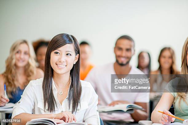 female college student in class - the bachelor stockfoto's en -beelden