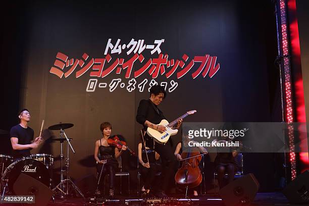 Musician MIYAVI performs during the Japan Premiere of 'Mission: Impossible - Rogue Nation' at the Toho Cinemas Shinjyuku on August 3, 2015 in Tokyo,...
