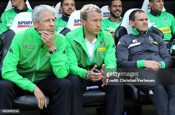 Head Coach Lucien Favre, Co- Trainer Frank Geideck and Co- Trainer Manfred Stefes of Borussia Moenchengladbach seen before the friendly match between...