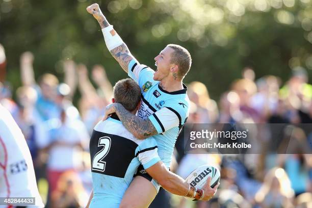 Nathan Stapleton of the Sharks celebrates with Todd Carney of the Sharks after Stapleton scored his fourth try during the round five NRL match...