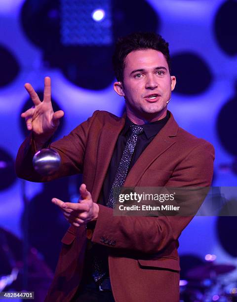 Entertainer Justin Willman performs a magic trick as he hosts the 13th annual Michael Jordan Celebrity Invitational gala at the ARIA Resort & Casino...