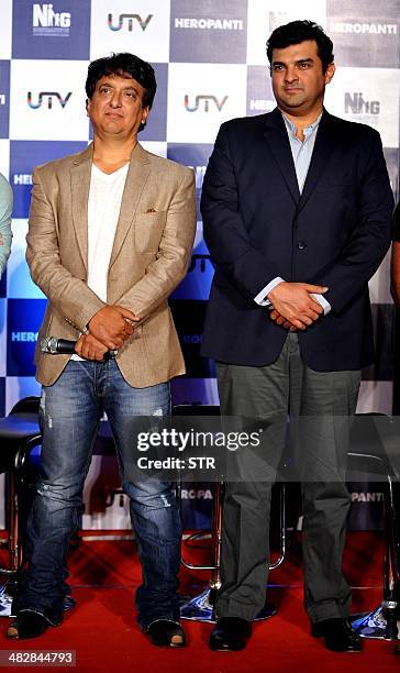 Indian Bollywood film producers Sajid Nadiadwala and Siddharth Roy Kapur pose during the launch of the trailer of the upcoming Hindi film 'Heropanti'...