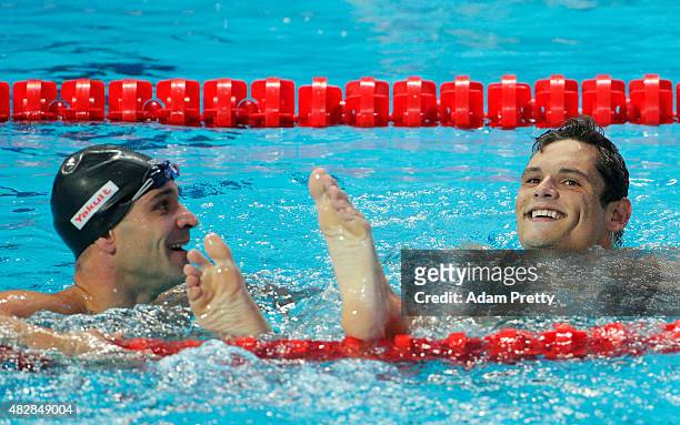Gold medal winner Florent Manaudou of France and sliver medal winner Nicholas Santos of Brazil react after the Men's 50m Butterfly Final on day ten...