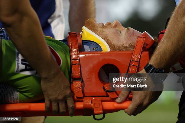 Joel Edwards of the Raiders is taken off the field on a stretcher after a heavy tackle during the round five NRL match between the Penrith Panthers...