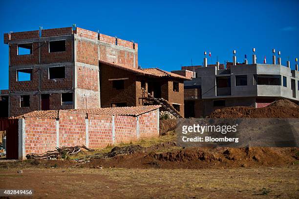 New buildings stand under construction in Chinchero, Peru, on Thursday, July 30, 2015. The Kuntur Wasi consortium, comprised of the Argentine holding...