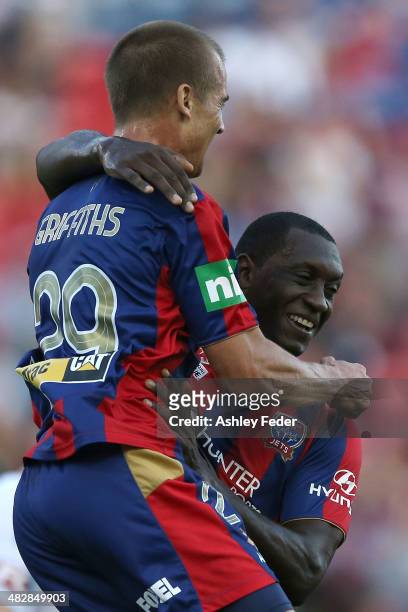 Emile Heskey and Joel Griffiths of the Jets celebrate a goal during the round 26 A-League match between the Newcastle Jets and Melbourne Victory at...