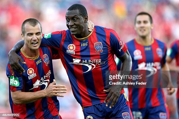 Emile Heskey and Joel Griffiths of the Jets celebrate a goal during the round 26 A-League match between the Newcastle Jets and Melbourne Victory at...
