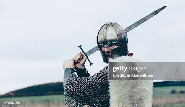 knight with sword and helmet is about to attack - historical reenactment stock pictures, royalty-free photos & images