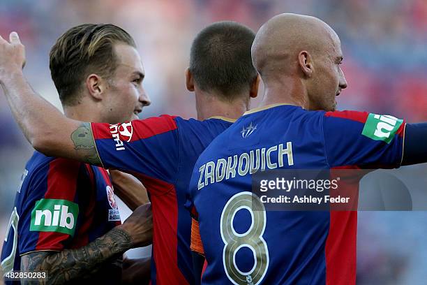 Adam Taggart Joel Griffiths and Ruben Zadkovich celebrate a goal by Adam Taggart during the round 26 A-League match between the Newcastle Jets and...