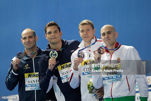 Gold medalist Florent Manaudou of France poses with silver medalist Nicholas Santos of Brazil and bronze medalists Laszio Cseh of Hungary and Konrad...