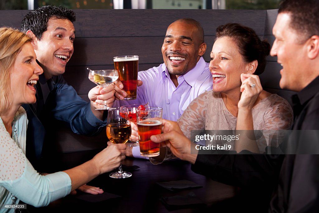 Group of friends having drinks at restaurant