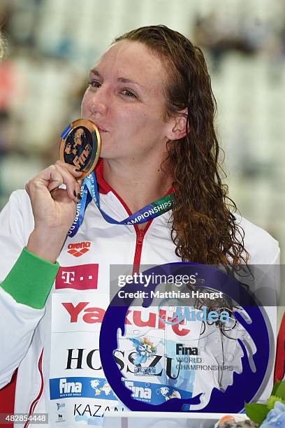 Gold medalist Katinka Hosszu of Hungary poses with the world record trophy during the medal ceremony for the Women's 200m Individual Medley Final on...