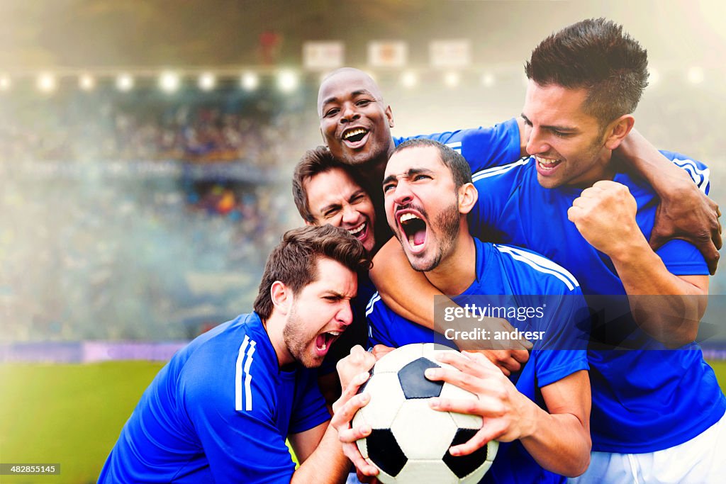 Football team celebrating a goal