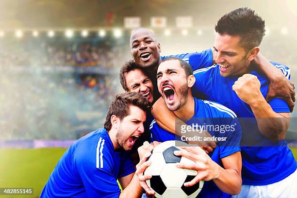 football team celebrating a goal - goals stock pictures, royalty-free photos & images