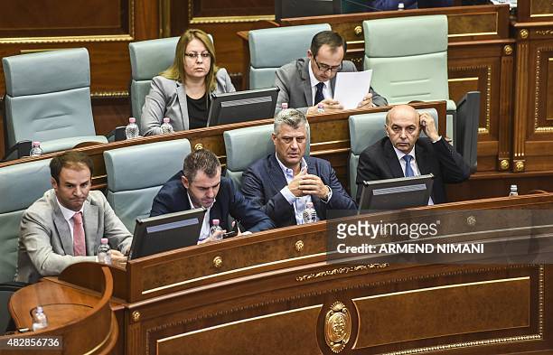 Kosovo's Prime Minister Isa Mustafa and Kosovo's Foreign Minister Hashim Thaci attend a parliamentary session in Pristina on August 3, 2015. Kosovo...