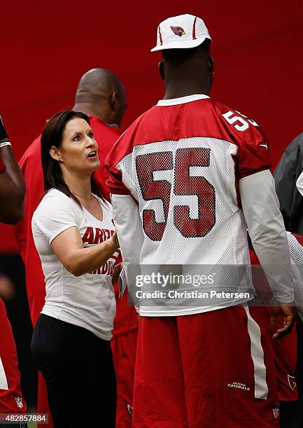 Intern linebacker coach Jen Welter of the Arizona Cardinals works with linebacker Sean Weatherspoon during the team training camp at University of...