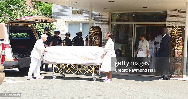 The body of Bobbi Kristina Brown is carried from the Whigham Funeral Home on August 3, 2015 in Newark, New Jersey. Bobbi Kristina Brown, daughter of...