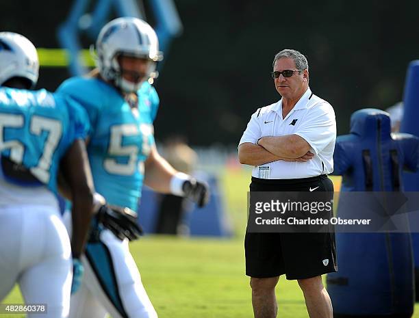 Carolina Panthers general manager Dave Gettleman, right, watches players run through drills during practice on Monday, August 3, 2015 in Spartanburg,...
