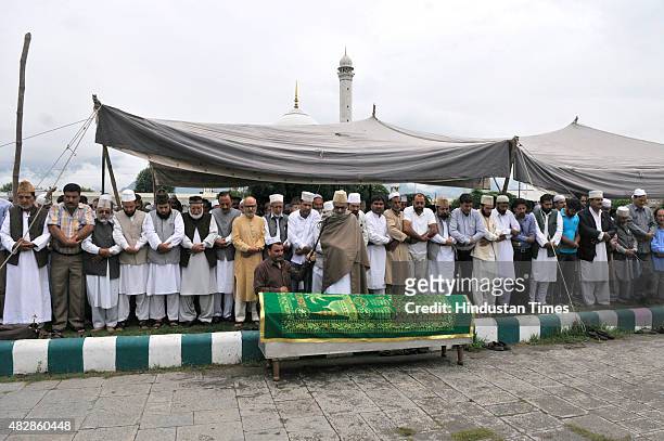 Kashmiri people offering funeral prayers to Imam Khateeb of Dargah Hazrabal shrine, Mufti Bashir Ahmad Farooqi on August 3, 2015 in Srinagar, India....