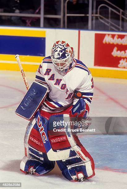 Goalie Mike Richter of the New York Rangers makes the save during an NHL game in November, 1993 at the Madison Square Garden in New York, New York.