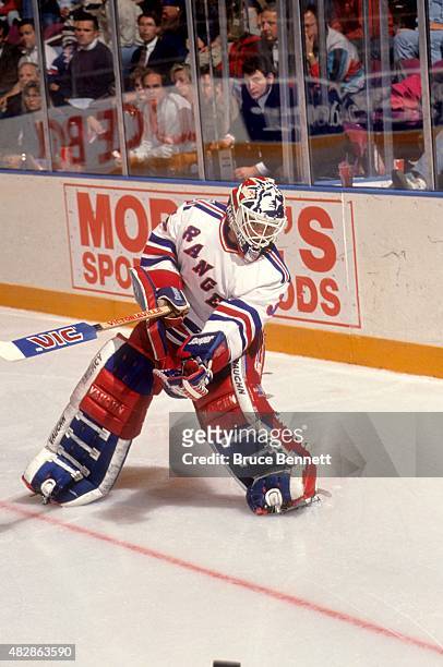 Goalie Mike Richter of the New York Rangers clears the puck during an NHL game in October, 1993 at the Madison Square Garden in New York, New York.