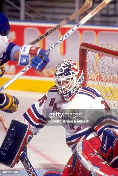 Goalie Mike Richter of the New York Rangers defends the net during an NHL game against the Quebec Nordiques on October 13, 1993 at the Madison Square...