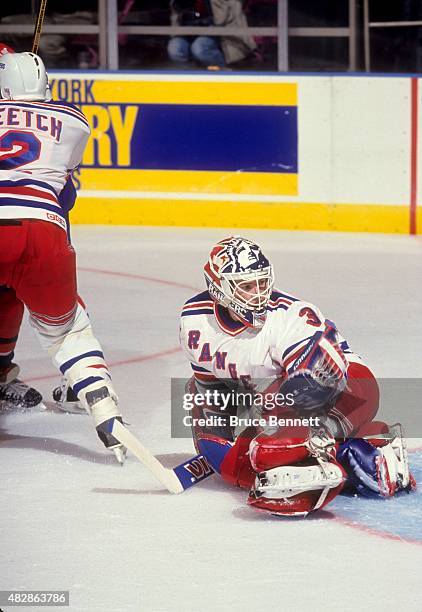 Goalie Mike Richter of the New York Rangers defends the net during an NHL game against the Washington Capitals on November 13, 1993 at the Madison...