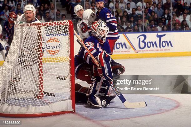 Goalie Mike Richter of the New York Rangers defends the net during an NHL game against the New York Islanders on April 10, 1994 at the Nassau...