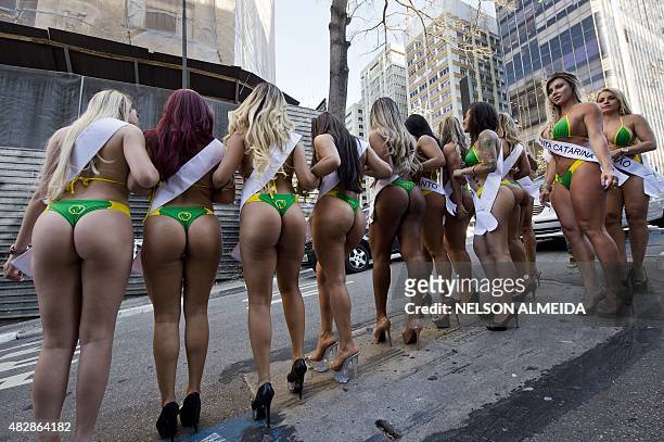 Models wearing bikinis perform at Paulista Avenue in Sao Paulo, Brazil on August 3 to promote the Miss Bumbum Brazil 2015 pageant. All eyes are on...