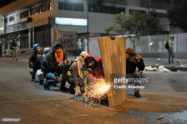 People protest Venezuela President Nicolas Maduro in Caracas, Venezuela on April 4, 2014. Protestors and police clash on the streets and about 40...